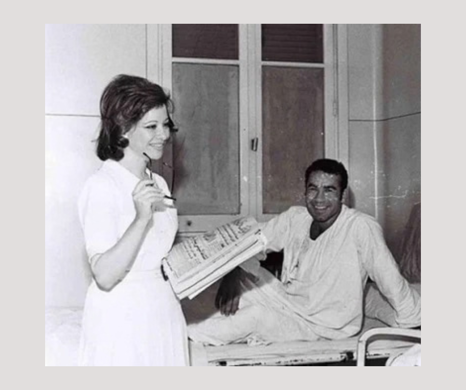 Nadia Lutfi beside a patient in a hospital ward